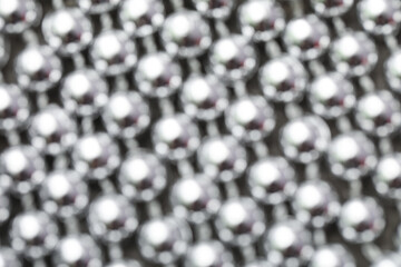 Shiny silver beads as background, closeup