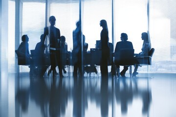 Silhouetted professionals in a business meeting.