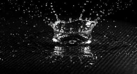 Water Crown Splash In High Speed Photography On Black Background