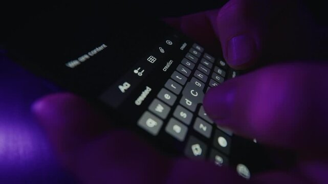 Hands Taking Notes On Smartphone Under Purple Light