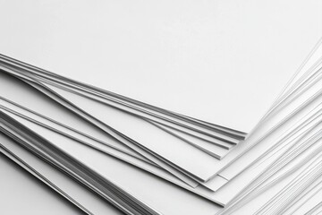 Stack of blank white paper sheets.  Close-up view of layered pages