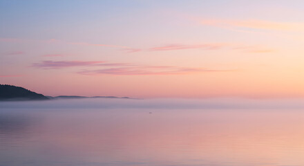 Fototapeta premium Dreamy Landscape Of Water With Coastal Fog In Pink Pastel Colors