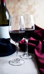 Naklejka premium Themed Event Prep: Wine Glasses Near Costume Pieces or Props