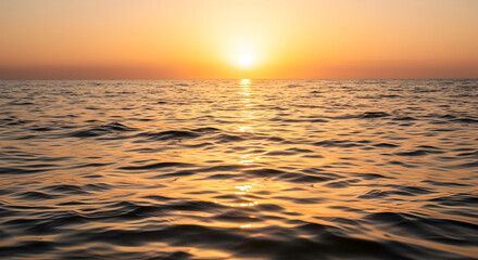 Fototapeta premium Golden Hour Over Sea Ripples Tranquil Water Surface At Sunset