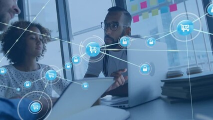 Team collaborating around desk, overlaying e-commerce security graphics with cart and padlock icons - Powered by Adobe