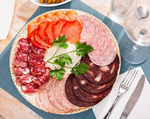 Slices of Spanish dry-cured gammon, variety of sausages and bacon