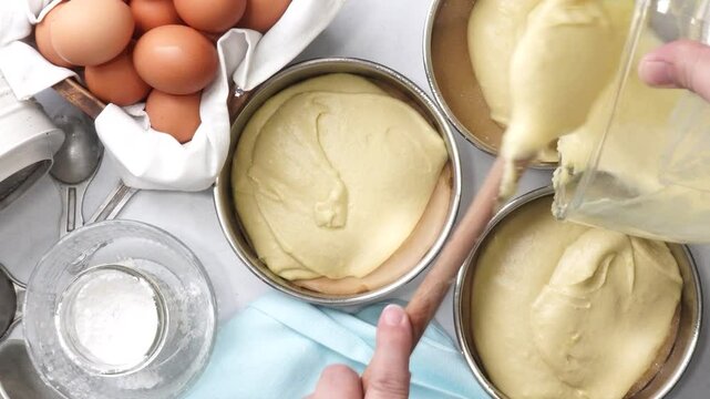 Baking a triple layer light blue cake with buttercream icing.  Decorating a vanilla cake for spring time.  Icing a cake and using coconut and candy eggs to make it look like a robin egg.