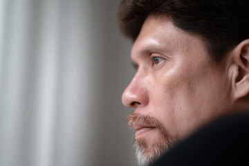 Obraz premium portrait of historian positioned on left side of frame with concentrated expression