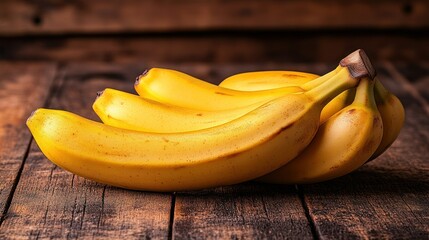 Ripe bananas on rustic wooden surface