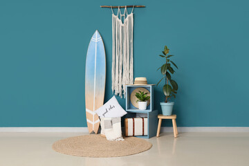 Interior of room with surfboard, shelves and plants