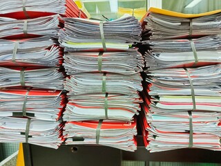 Stack of Documents Tied Together with Rubber Bands