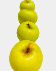 Stack of Four Green Apples on White Background