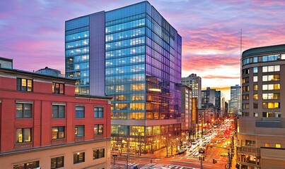 Modern Cityscape at Sunset with Illuminated Buildings