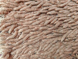 Close-up of Soft Brown Chenille Fabric Texture Background
