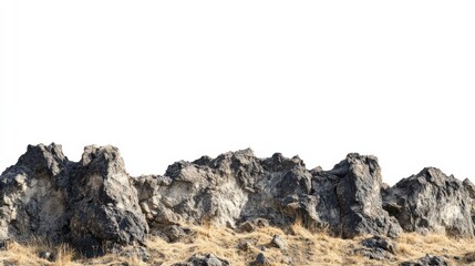 Rocky Outcrop with Dry Grass against Clear White Background in Natural Landscape Scene