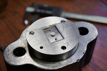 Precision engineering in metalworking showcasing a cutting press component during the manufacturing...
