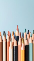 Colored pencils, close-up, on blue background, variety of shades