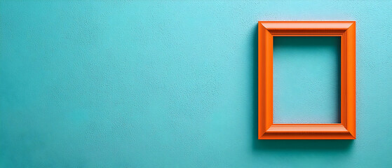 Orange Picture Frame Against Teal Textured Wall