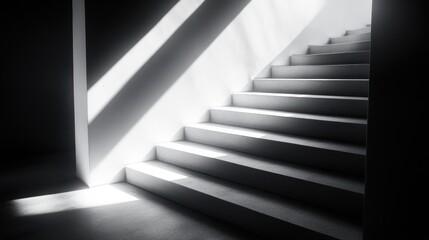Fototapeta premium Ascending staircase in stark monochrome, bathed in luminous light beams