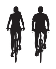 Silhouette of a couple riding a bicycle