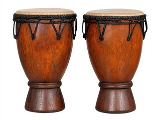 Two brown wooden djembe drums isolated on white background. The drums have dark brown rope detailing around the top. Studio lighting illuminates the drums evenly.