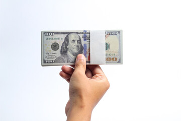brown skinned man holding 100 dollar bill isolated on white background.business and finance concept