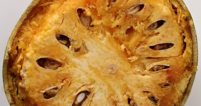 Southeast Asa wood apple bael fruit Limonia acidissima hard shell half inside flesh made juice drink ingredients 