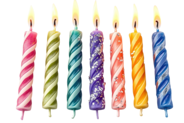 Six brightly colored spiral birthday candles lit against a black background perfect for on transparent background