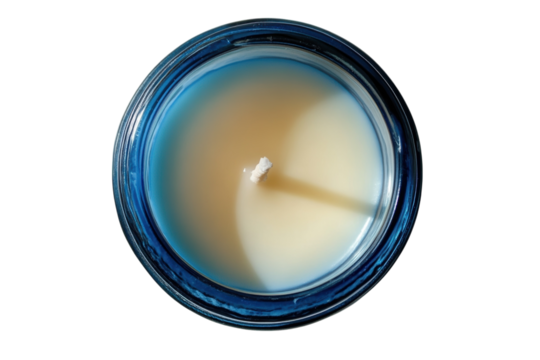 Unlit cream candle in a blue glass jar ready to bring warmth and serenity to your space Top on transparent background