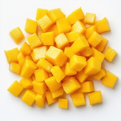 Diced ripe mango fruit pieces on a white background