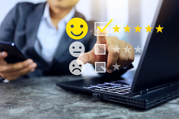 Customer feedback concept with businessman give a five star and yellow smile face icon to satisfaction survey high satisfaction with the products and services received