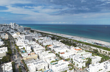 Naklejka premium Miami Beach aerial drone view with skyline. Miami from above. Drone view of Miamis famous landmarks. South Pointe beach with skyscrapers. Miami city panorama. Oceanfront skyline of Miami Beach.