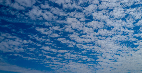 White clouds on blue sky. Beautiful sunny sky. Background with clouds on blue sky. Clouds on sky backdrop.