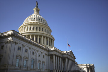 Obraz premium Congress and Capitol. Independence Day in USA. Capitol is freedom and justice in America. The dome of the Capitol in Washington DC. The United States flag on the Capitol building.