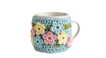 White ceramic mug with blue crochet cozy and pastel flowers isolated