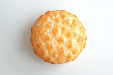 Close up of a single golden brown hash brown on a white surface