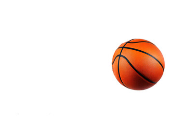 A single basketball isolated against a stark black background in