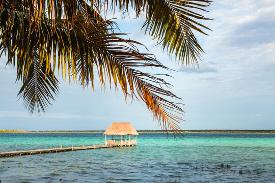 Jetty with small hut over the turquoise water, Laguna Bacalar, Mexico