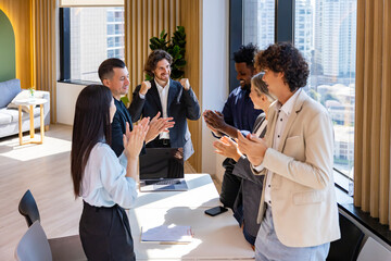 Team of happy diversity business people agreement on deal over new strategic strategy project on...