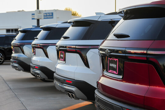 A lineup of new Chevrolet SUVs with AutoNation dealer plates showcases inventory readiness, branding consistency, and retail fleet presentation at a franchised auto dealership