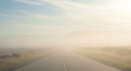 Misty Road Leading to Mountains at Sunrise