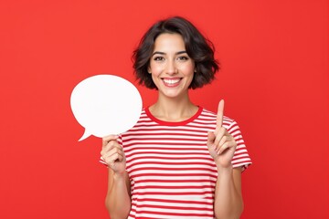Smiling woman in striped shirt holding blank speech bubble and pointing up, colorful style on red background, concept of social communication or creative issue. Ai generative