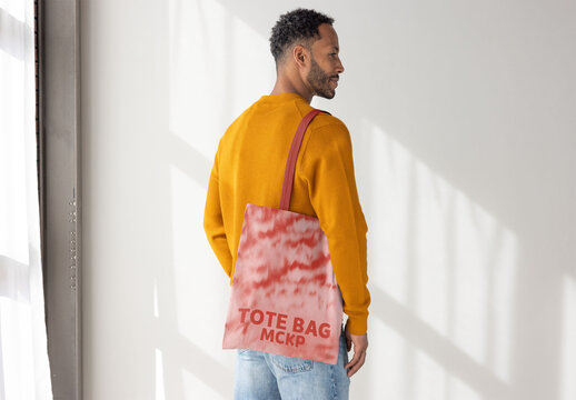 Man With Tote Bag in Bright Light. PSD template ready for Mockup
