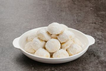 Kue Putri Salju or Snow White Cookies with round shaped. Made from flour, sugar and butter coated with powdered sugar. 