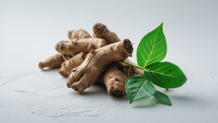 Obraz premium Fresh Leaves and Dry Root of Ashwagandha Isolated on White Background