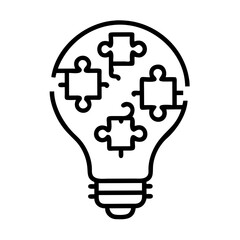 Teamwork concept depicted as a light bulb made from puzzle pieces silhouette