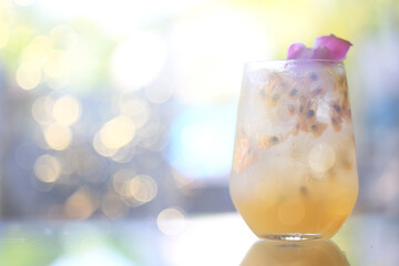 passion fruit lemonade background, cold lemonade in a glass, delicate texture cold tropical drink background