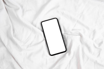 Smartphone mockup screen on white bed sheet