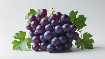 Fototapeta premium Juicy grapes with green leaves against a white backdrop