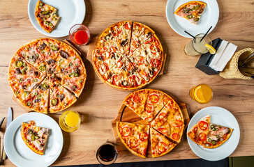 A gourmet pizza spread with unique toppings promises a feast for everyone